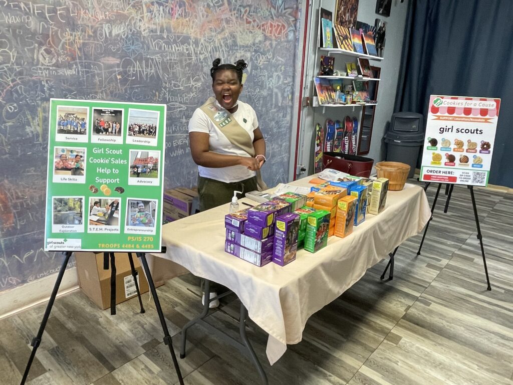 Girl Scout Cadette hosting cookie booth